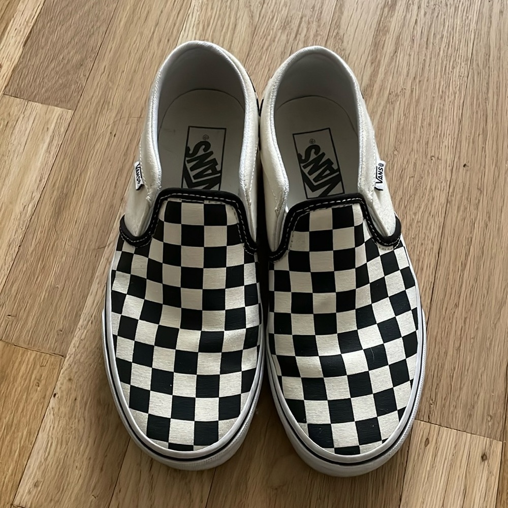 Women’s black and white checkerboard Vans Size 6